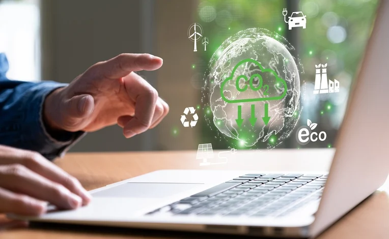 Laptop open with sustainability features. 